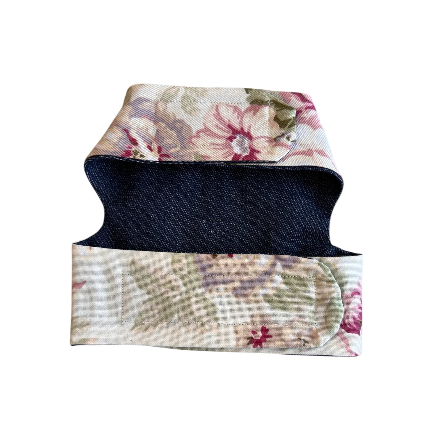 Floral-patterned dog harness on a white background