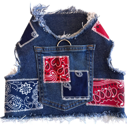 Denim harness with red &blue bandana patches on a white background