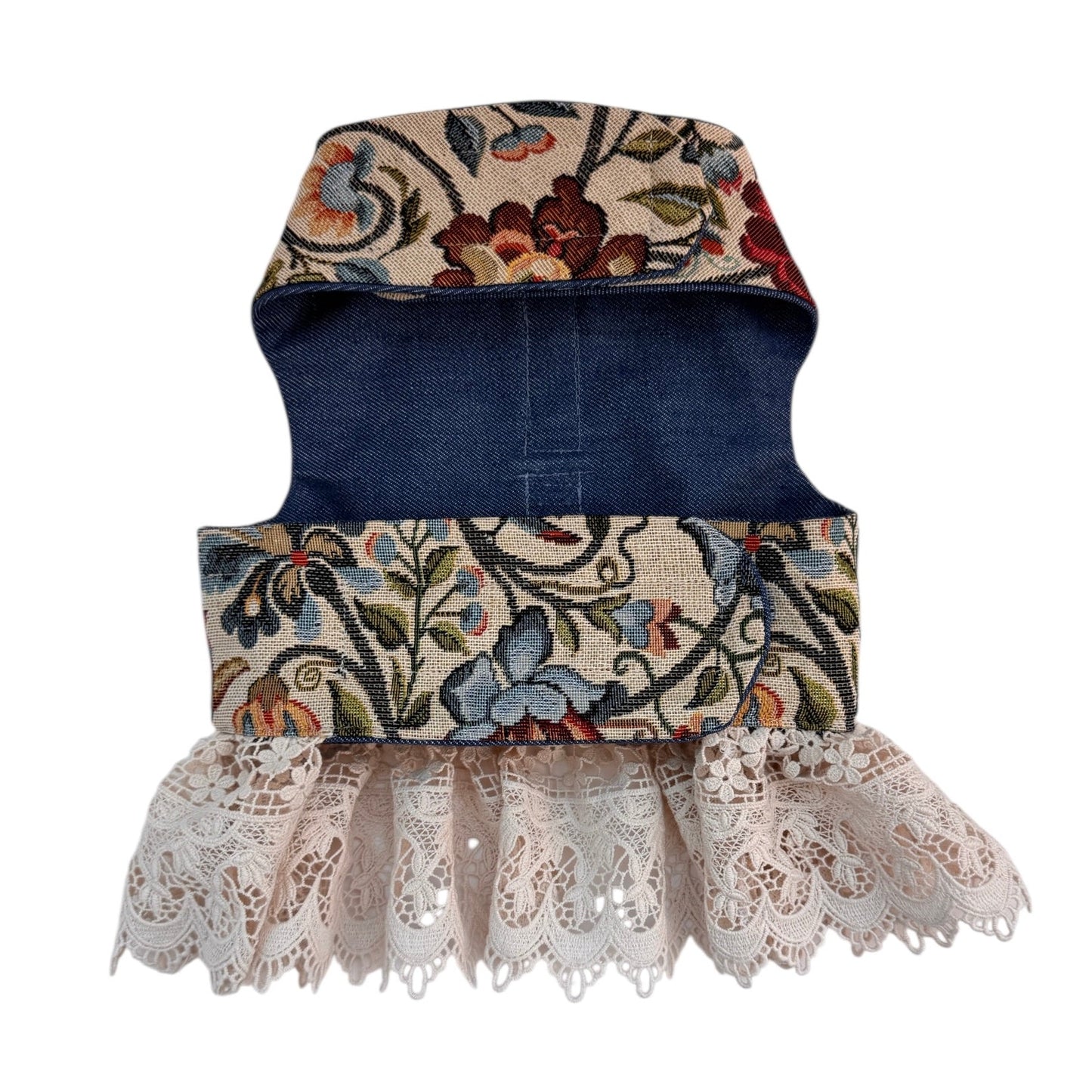 Dog harness with floral pattern and lace trim on a white background