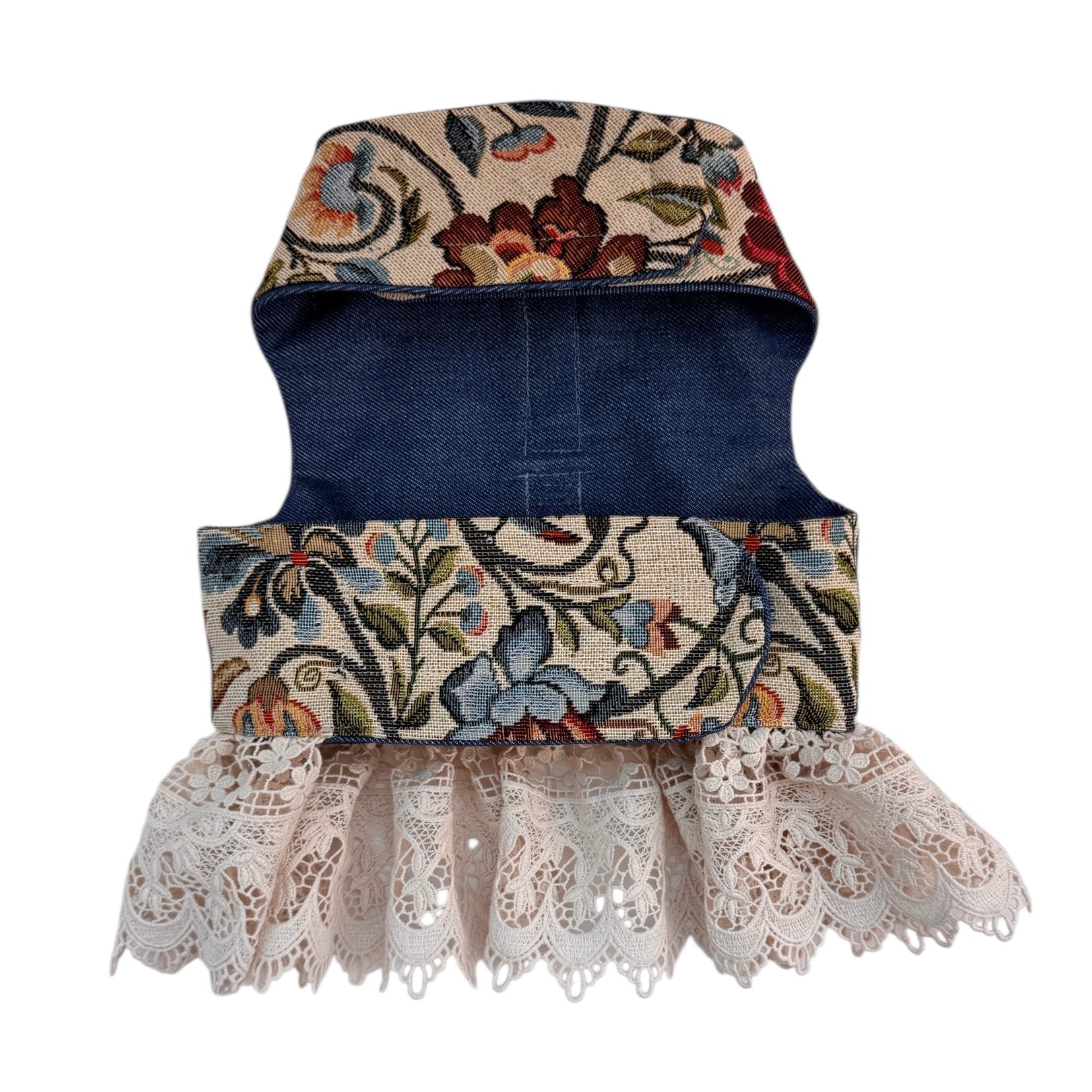 Dog harness with floral pattern and lace trim on a white background