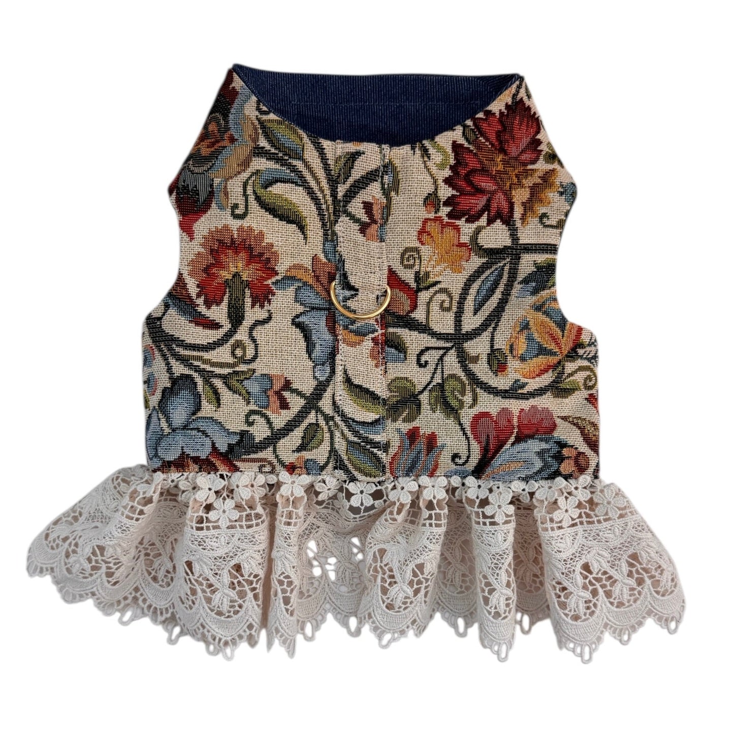 Floral patterned dog harness with lace trim on a white background