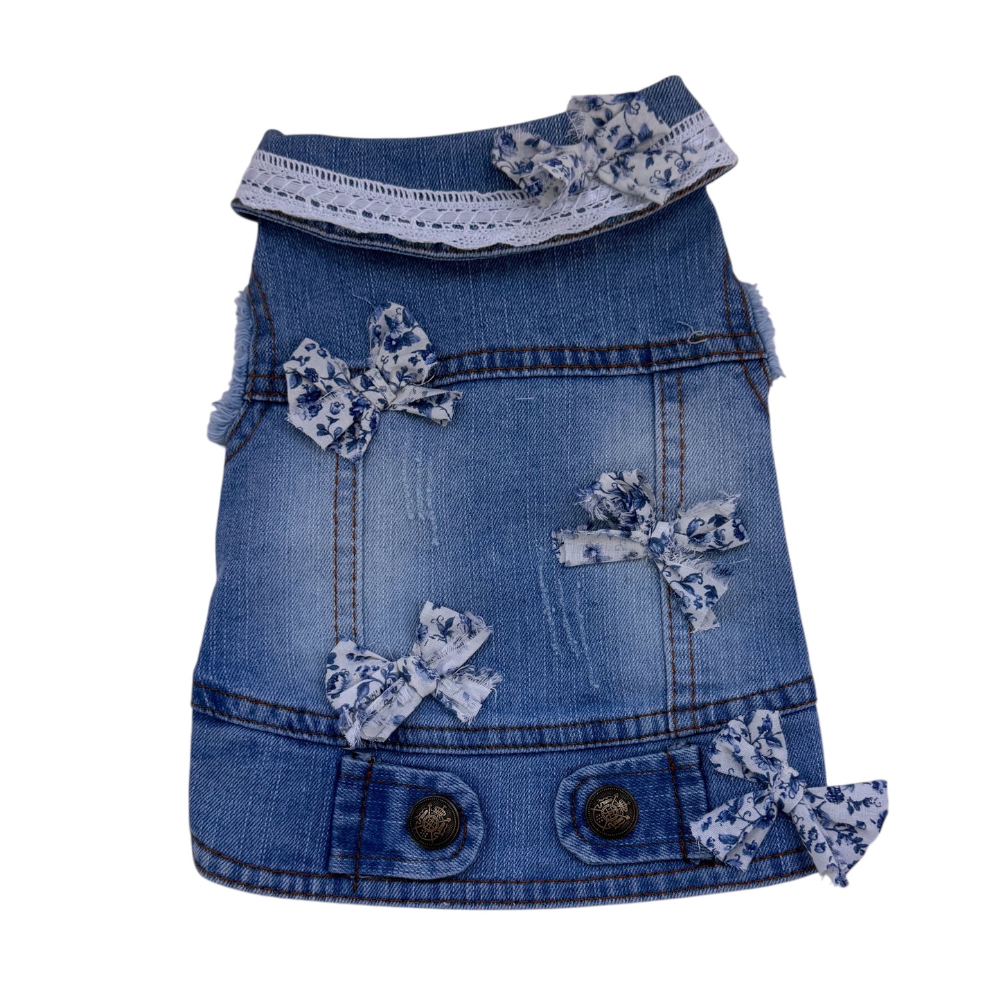 Denim dress with blue bows on a white background