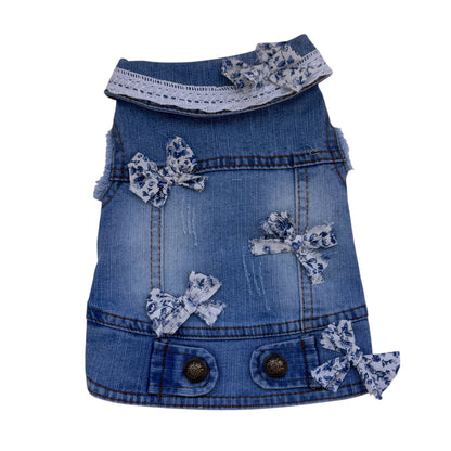 Denim dress with blue bows on a white background