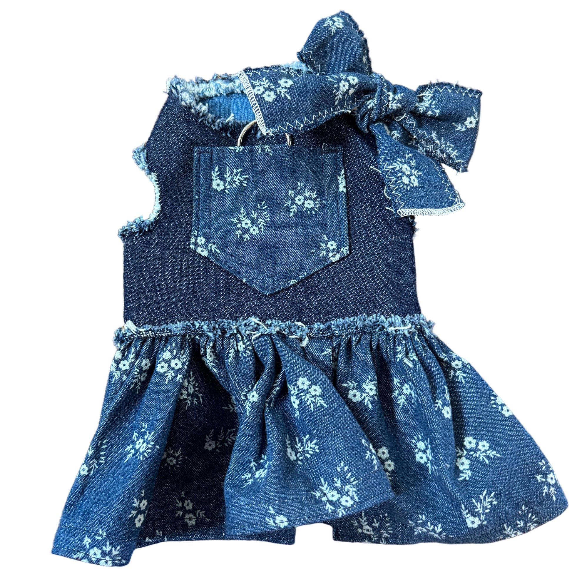 Blue floral dress with ruffled details on a white surface