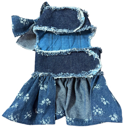 Blue denim bow with floral patterns on a white surface