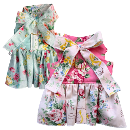 Two floral dresses with ruffled details on a white background