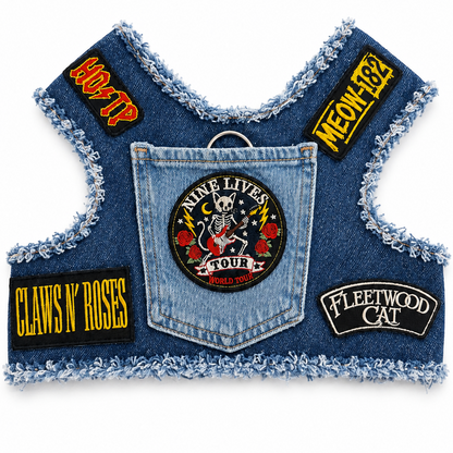A denim vest accessory with a frayed edge, featuring multiple rock-themed patches including 'Claws 'N' Roses', 'Nine Lives Tour', 'Meow-182', 'Fleetwood Cat'