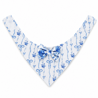 A white triangular pet bandana with a blue watercolor-style ribbon and floral pattern, featuring a matching blue bow at the center collar, displayed on a clean white background.