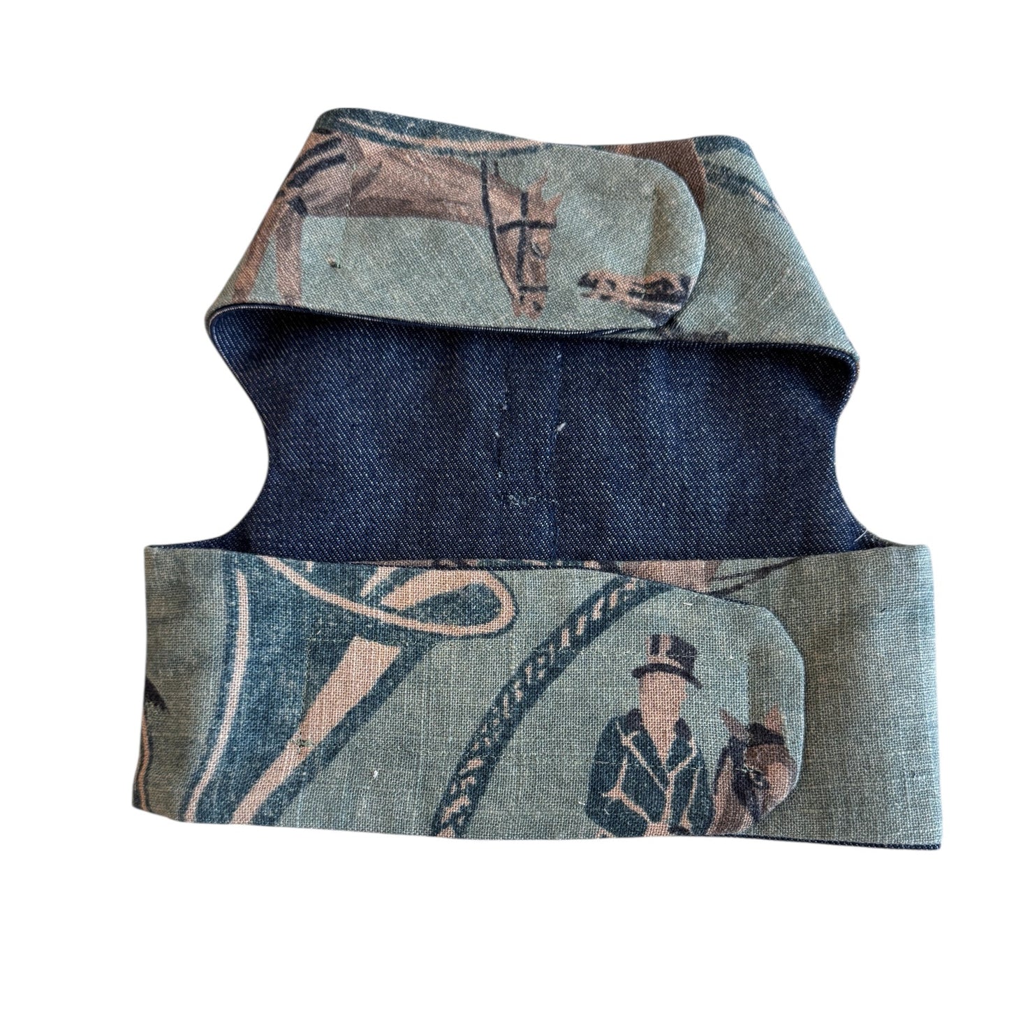 Denim vest with vintage-style graphic design on a white background