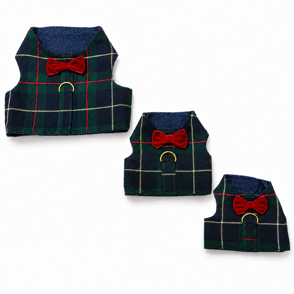 Three small plaid pet vests in navy, green, and red tartan, each with a red bow tie detail and gold-tone ring hardware, arranged on a white background.