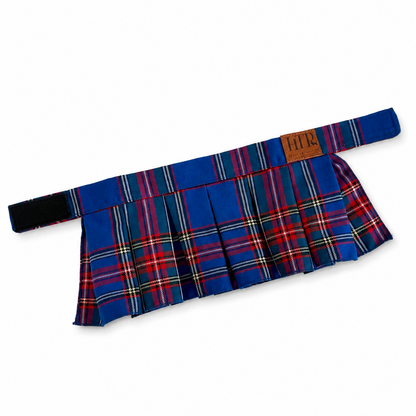 A pleated tartan skirt in a blue, red, and yellow plaid pattern, featuring a matching waistband with a brown leather brand patch that reads 'HTP'.