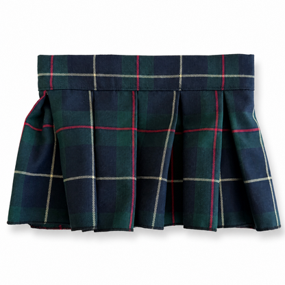 A pleated plaid skirt in navy blue with green, red, and white intersecting stripes, shown flat against a white background.