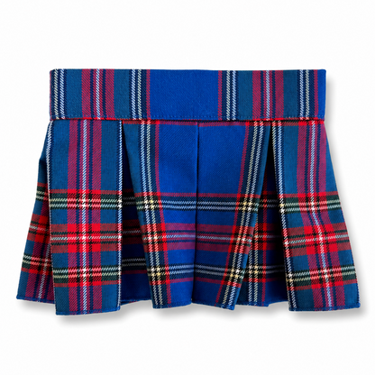 A pleated tartan skirt in royal blue with red, green, and white plaid stripes, shown flat against a white background.